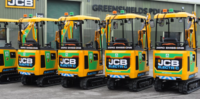 Five JCB Electric Mini Diggers Outside JCB Warehouse