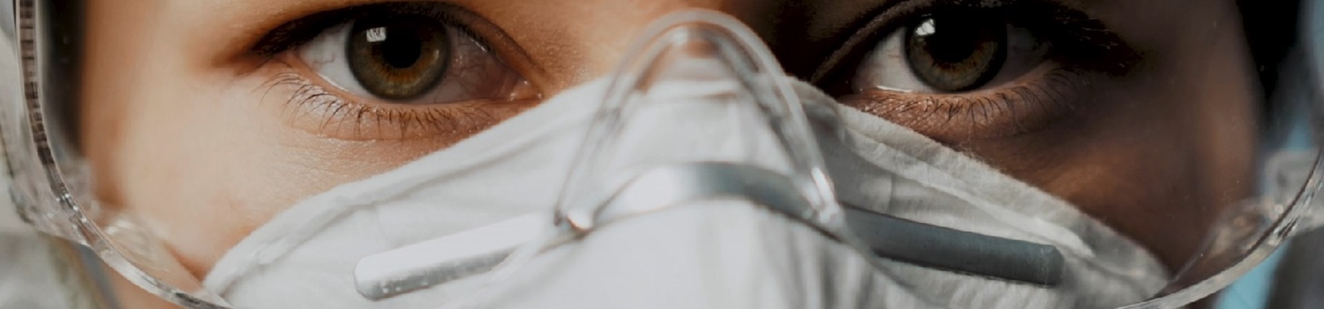 Women Wearing Face Mask And Goggles, While Taking Part In A Face Fit Test