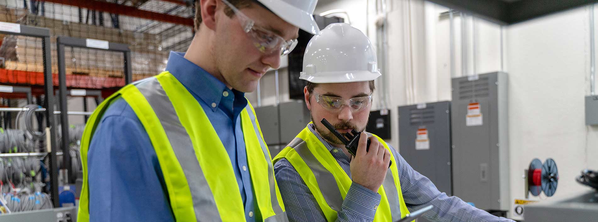 Man Using Two Way Radio At Power Plant
