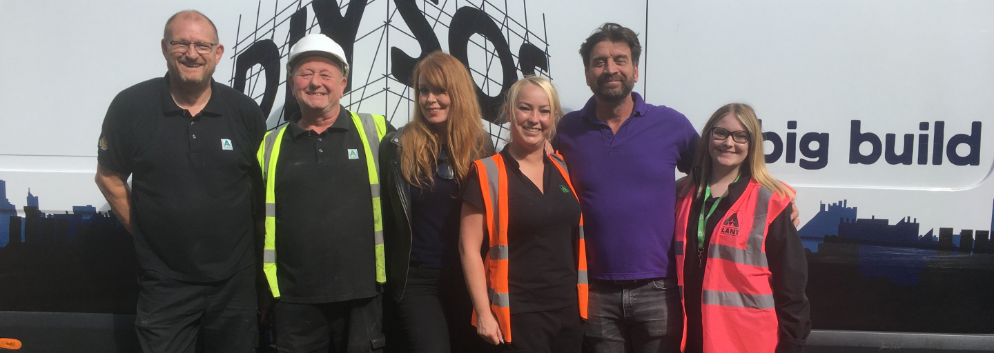 DIY SOS with Sunbelt Rentals team in front of a white van