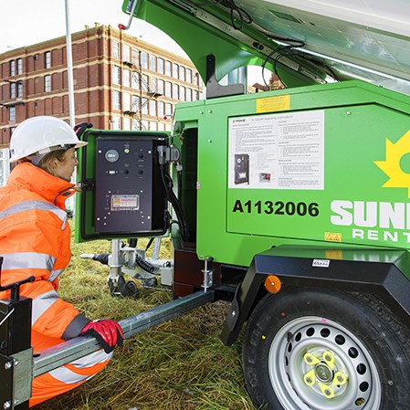 A Sunbelt Rentals Operative Inspects A Solar Tower Light