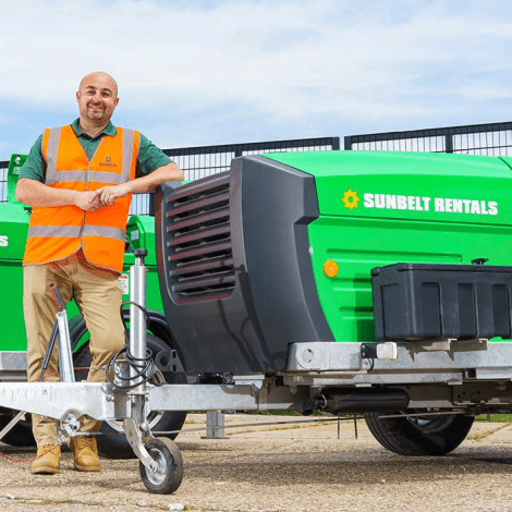 Sunbelt Rentals Employee Stood Next To Two Winches