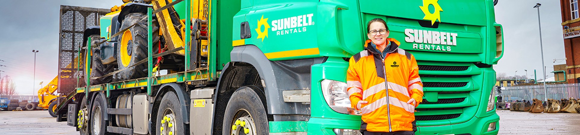 Jamie Walls Class 2 HGV Driver Stood With Sunbelt Rentals HGV Vehicle