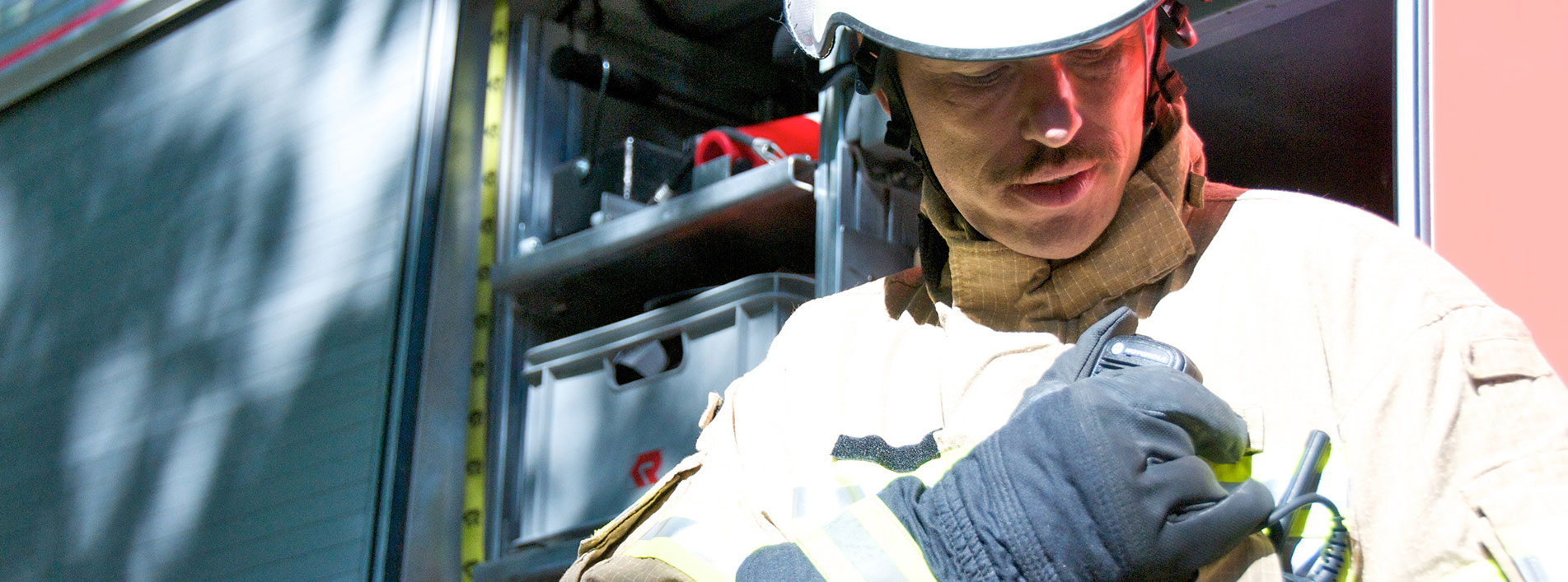 Fireman Using Two Way Radio Accessory