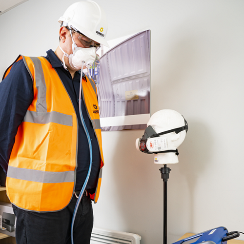 Man getting a face mask tested and fitted