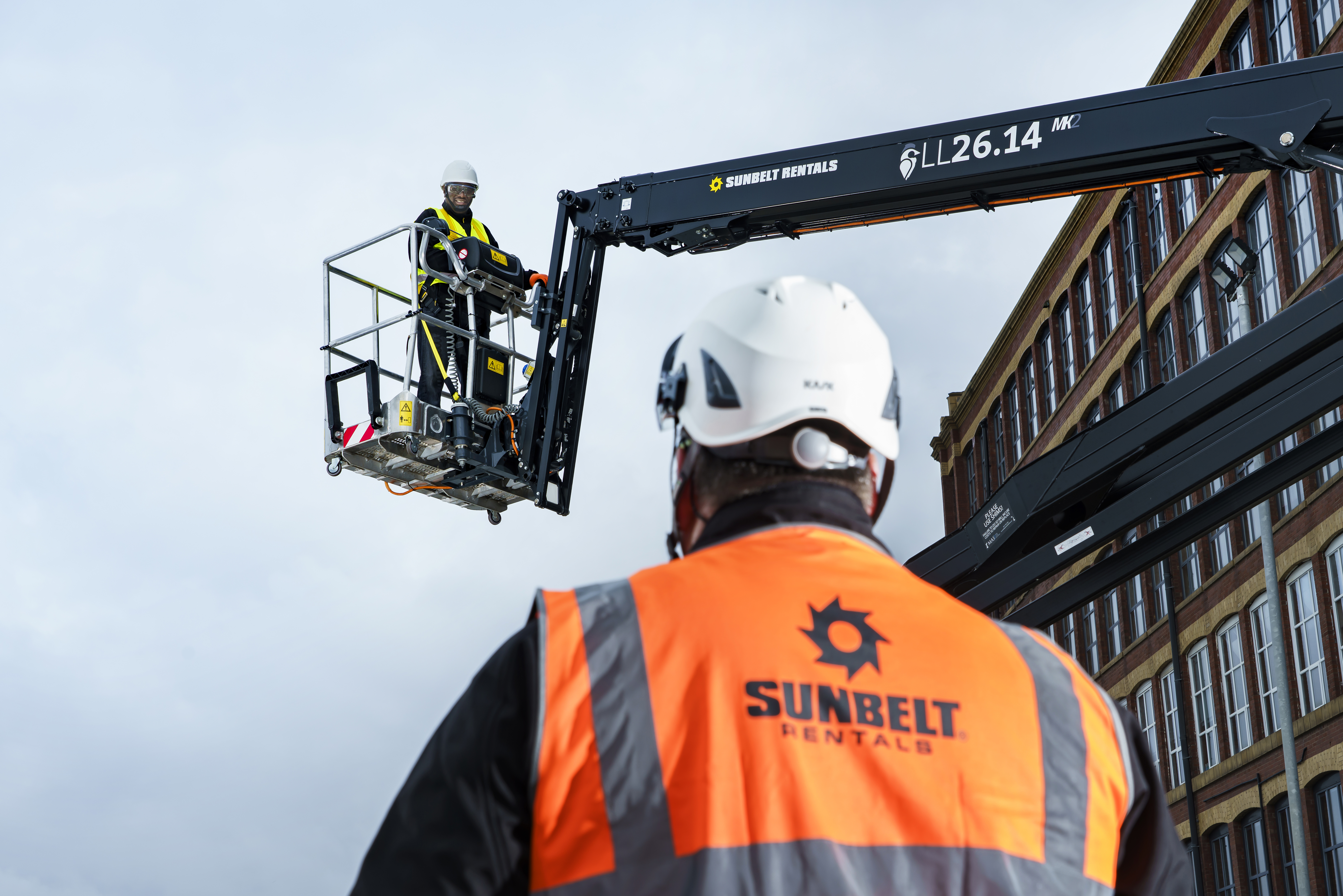 A Sunbelt Rentals trainer observing a man working at height