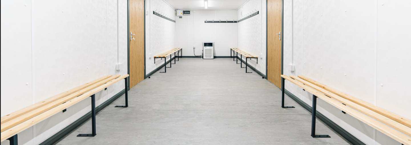 interior of a drying room with brown wooden boards