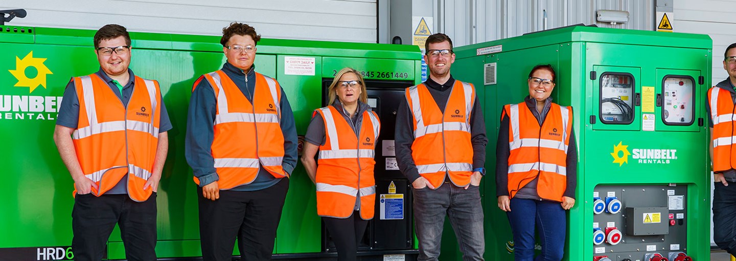 Sunbelt Workers Stood In front Of Battery Storage Unit Green  Energy Solution