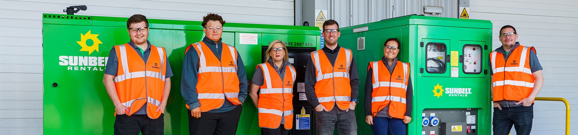 Sunbelt Workers Stood In front Of Battery Storage Unit Green Energy Solution